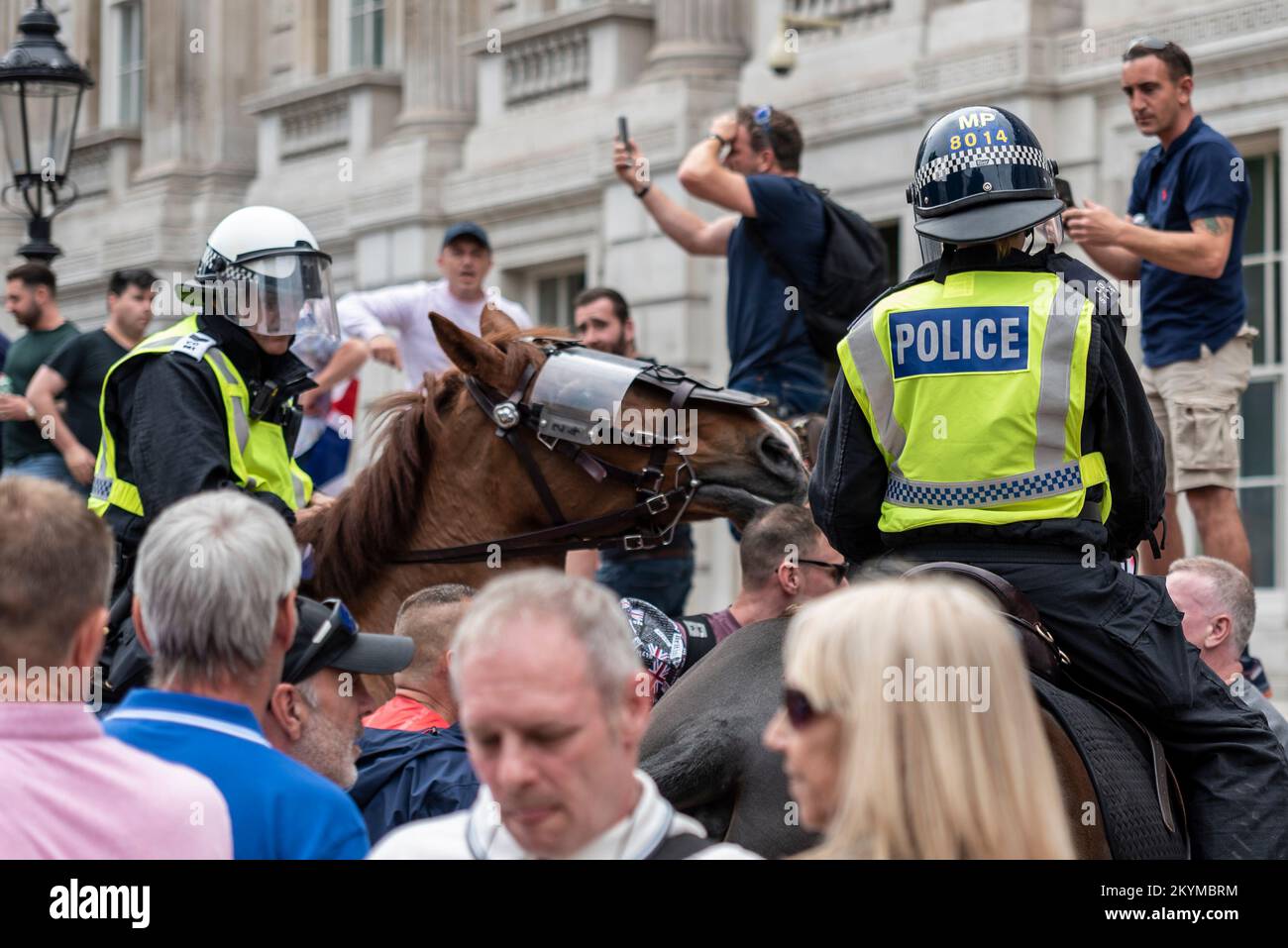 Supporters of Tommy Robinson, such as the EDL protested in London demonstrating for his release after arrest. Mounted police officers among protesters Stock Photo