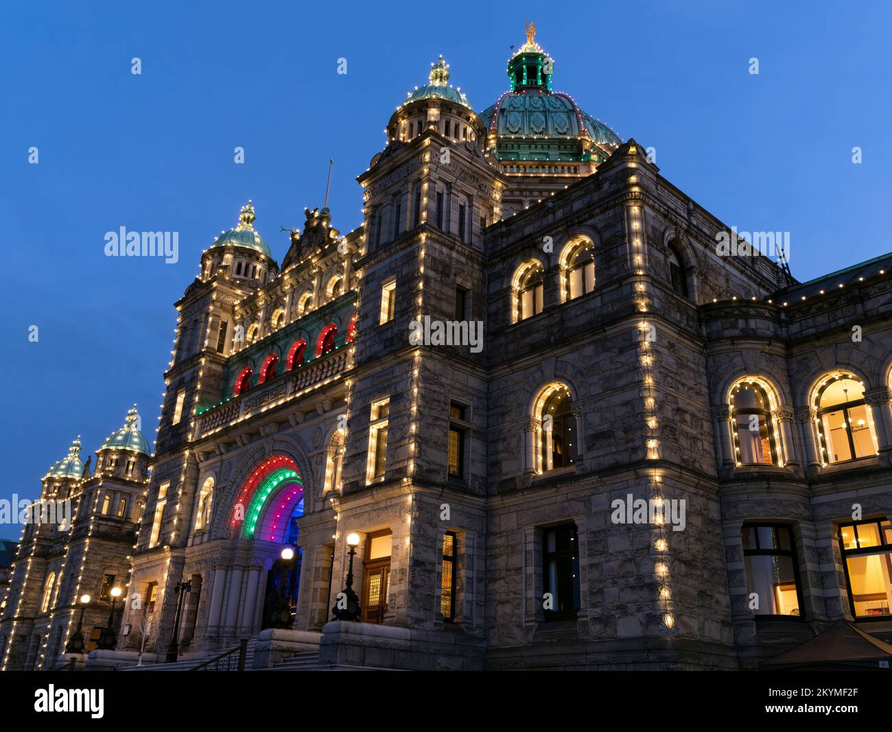 The British Columbia Parliament Buildings in Victoria, seen at dusk with holiday lights. Stock Photo