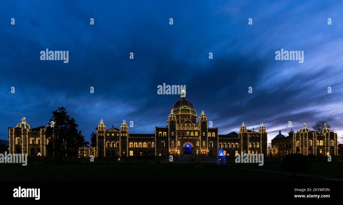 The British Columbia Parliament Buildings in Victoria, seen at dusk with holiday lights. Stock Photo
