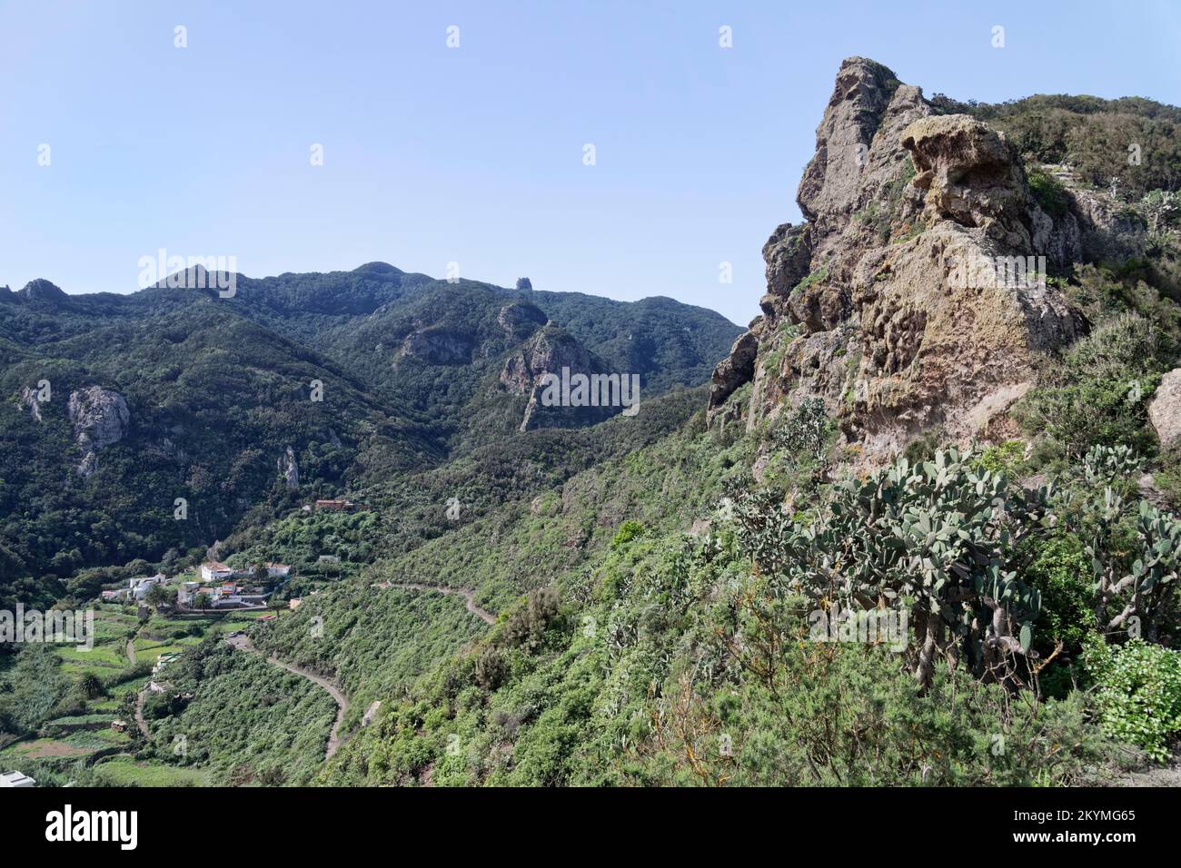Overview of Chamorga village with Roque Bichuelo peak in the foreground, Anaga mountains, Tenerife, Canary Islands, Spain, November. Stock Photo