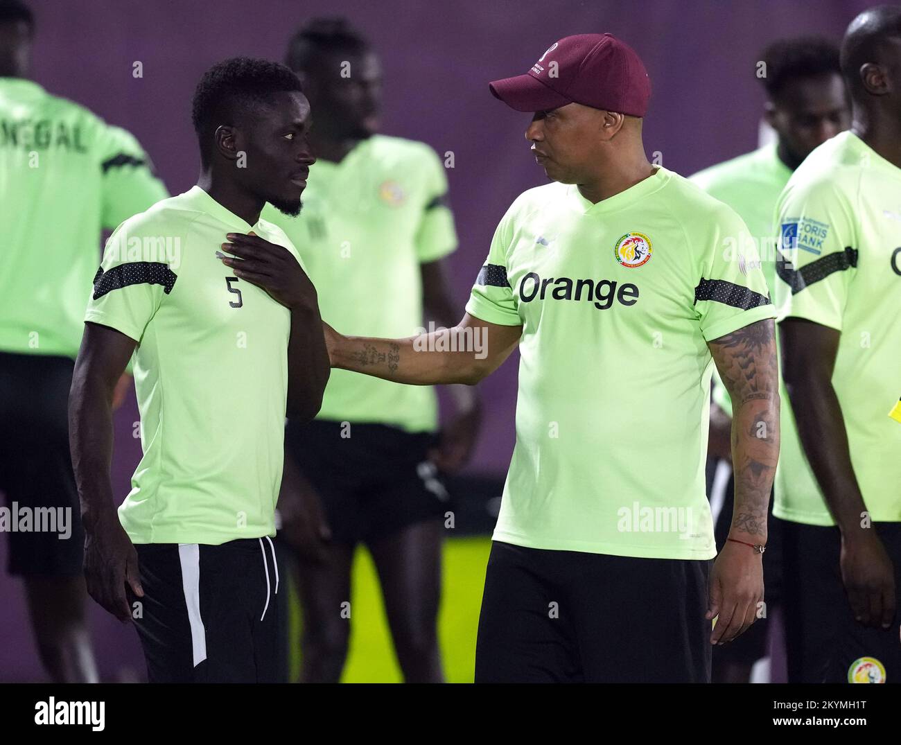 Senegal's Idrissa Gueye (centre) with El Hadji Diouf during a training session Al Duhail SC, Doha, Qatar. Picture date: Thursday December 1, 2022. Stock Photo