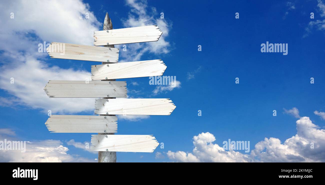 Wooden signpost with many clear arrows Stock Photo - Alamy