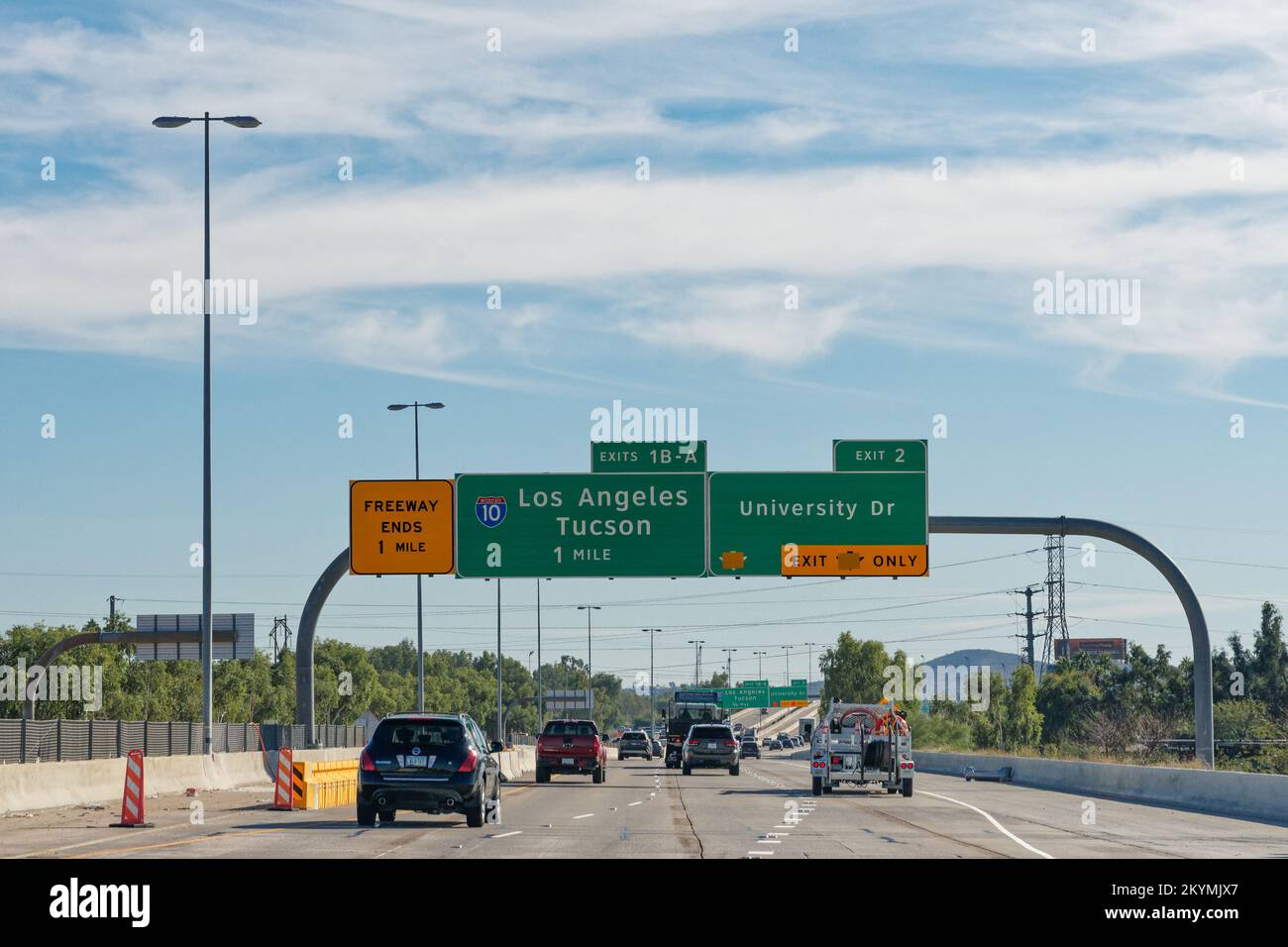 Phoenix, AZ - Nov. 14, 2022: Signs for Exit 2 for University Dr and Exit 1B-A for I10 toward Los Angeles and Tucson off of Arizona State Route 143, al Stock Photo