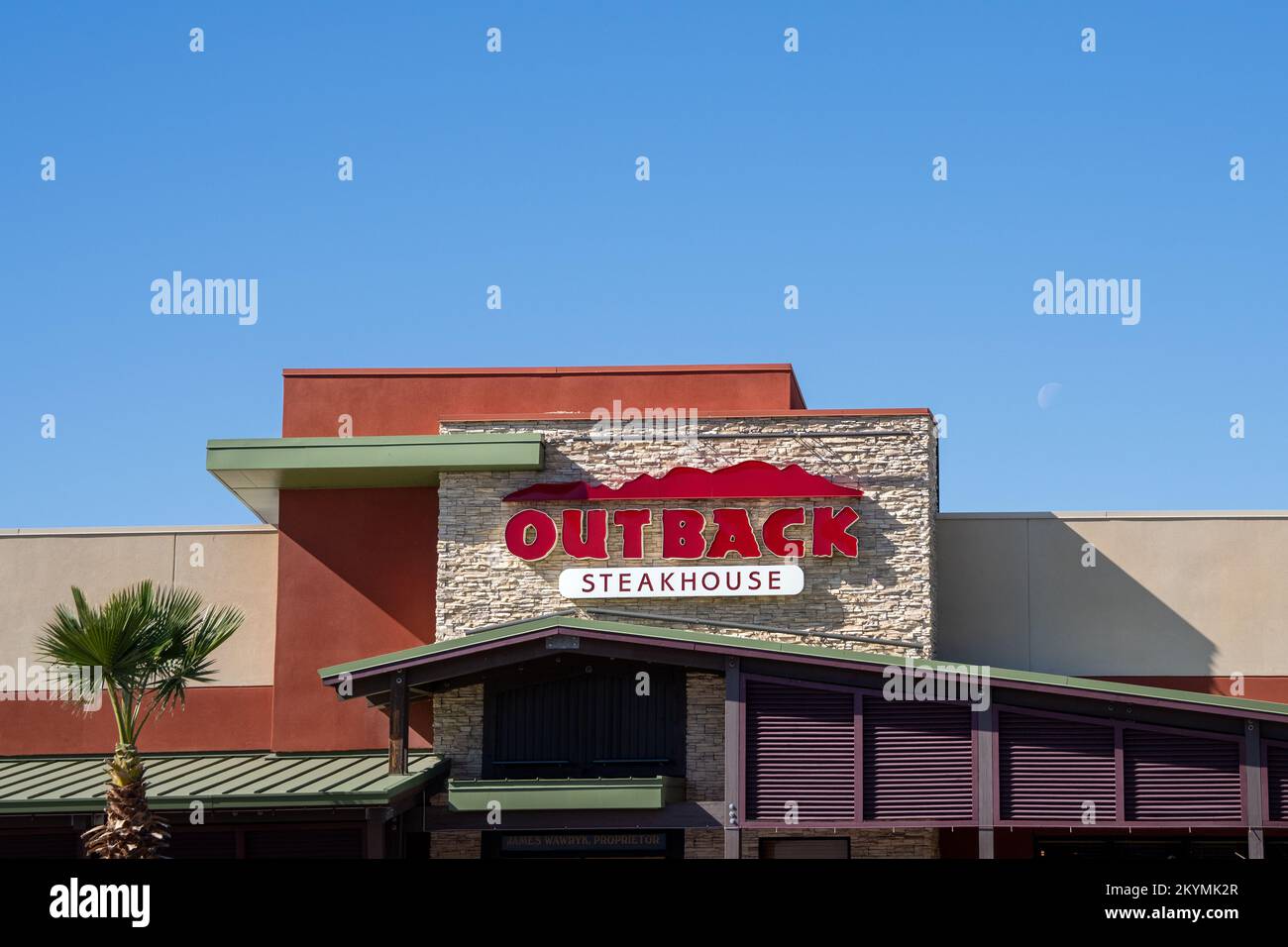 Phoenix, AZ - Nov. 15, 2022: Outback Steakhouse chain restaurant in Village Crossroads at E. Cactus Rd. & N. Tatum Blvd Stock Photo