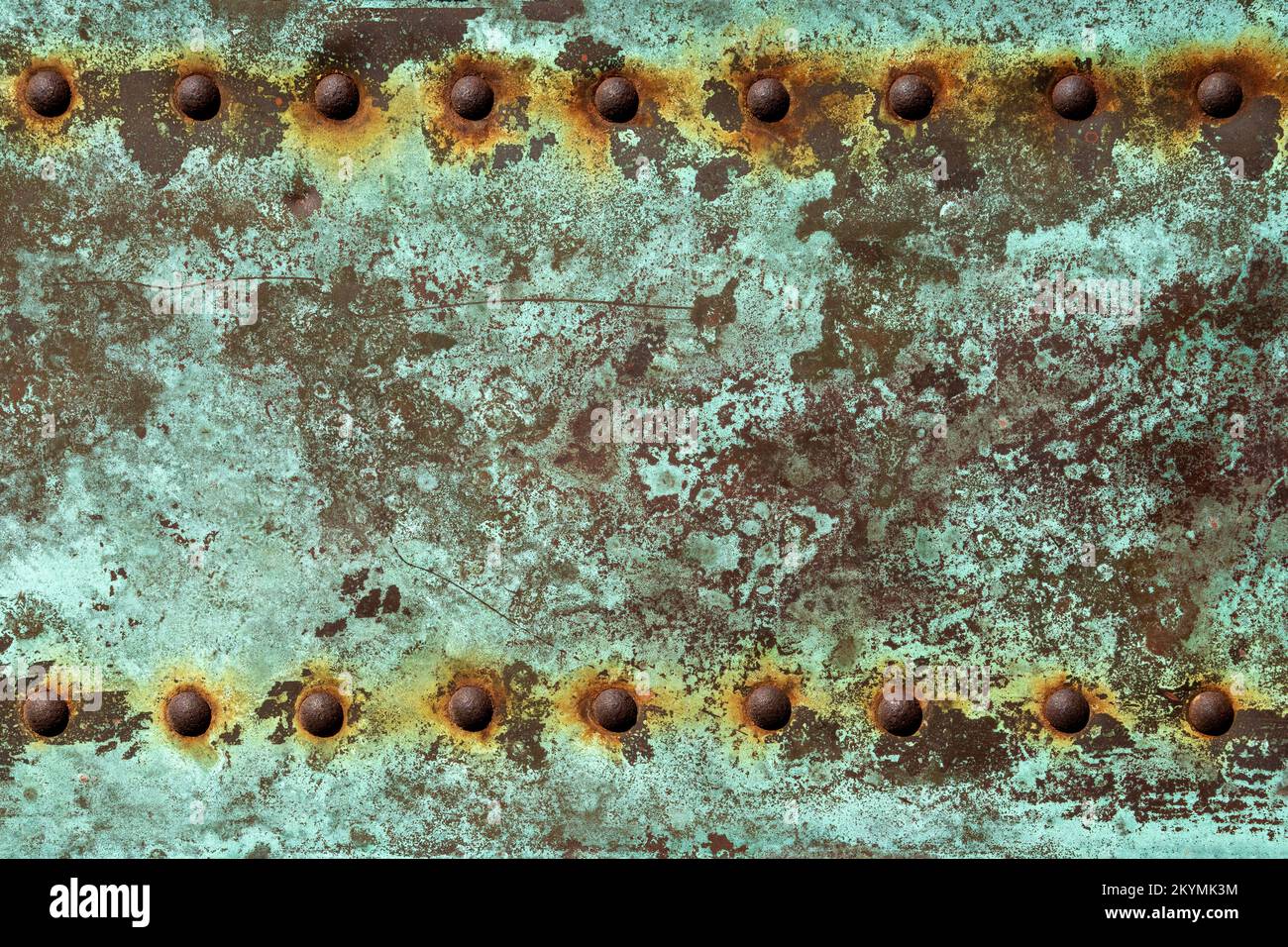 green verdegris background with rusted rivets Stock Photo