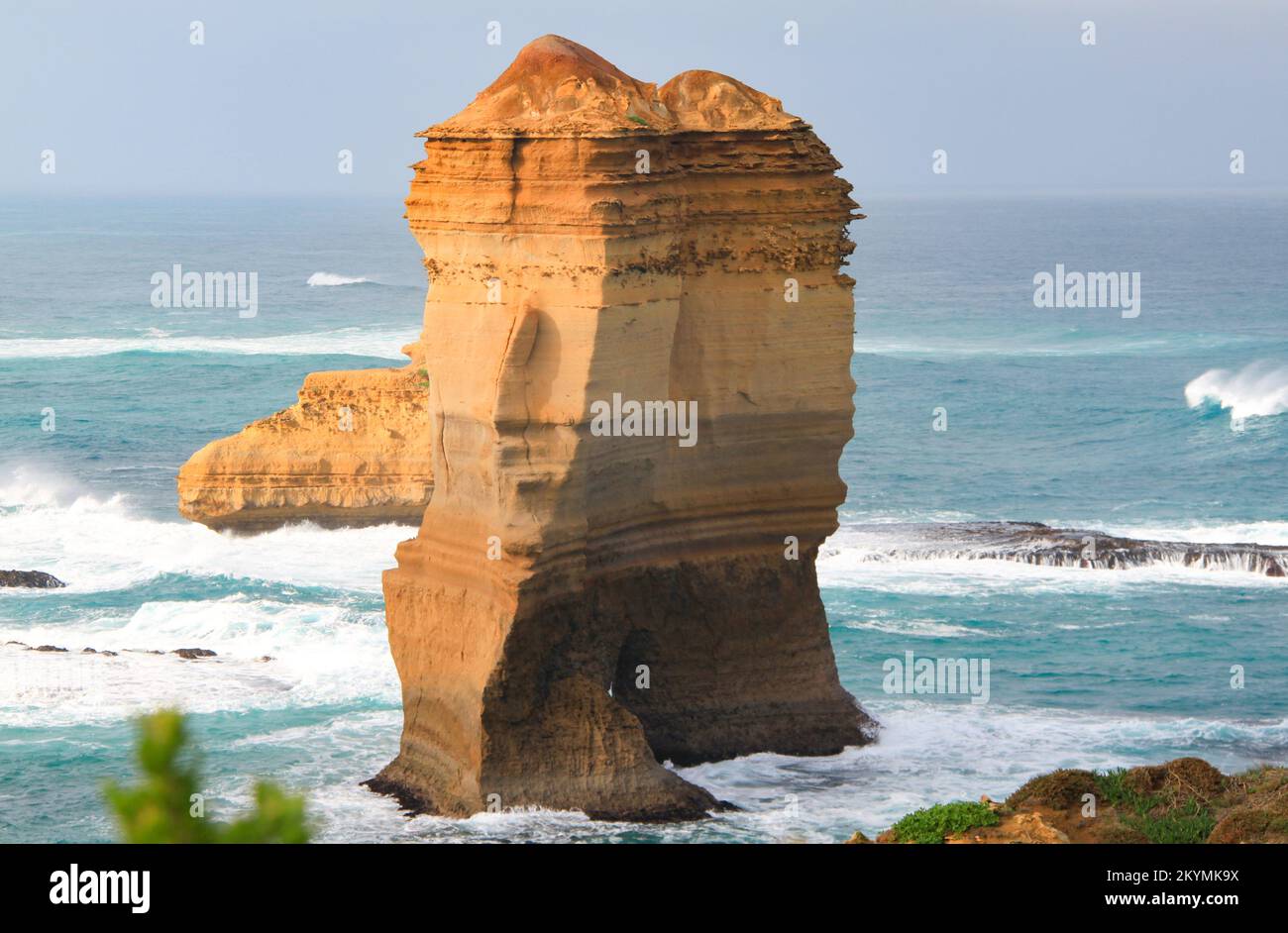 One of the twelve apostles on the Great Ocean Road south of Australia. Surrounded by high waves, he defies the mighty forces of nature Stock Photo