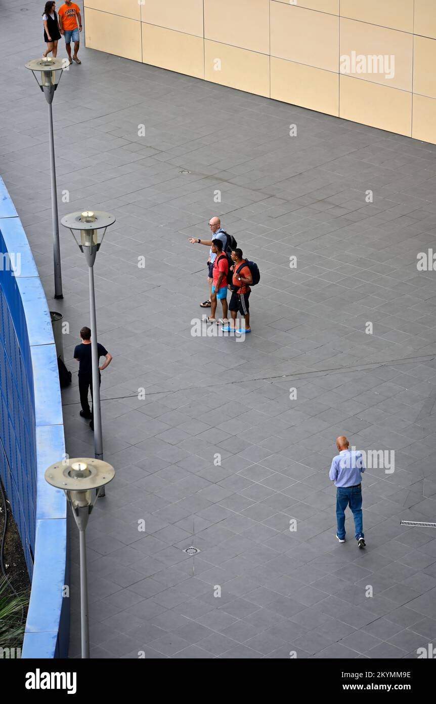 View from above people standing, walking pointing Stock Photo