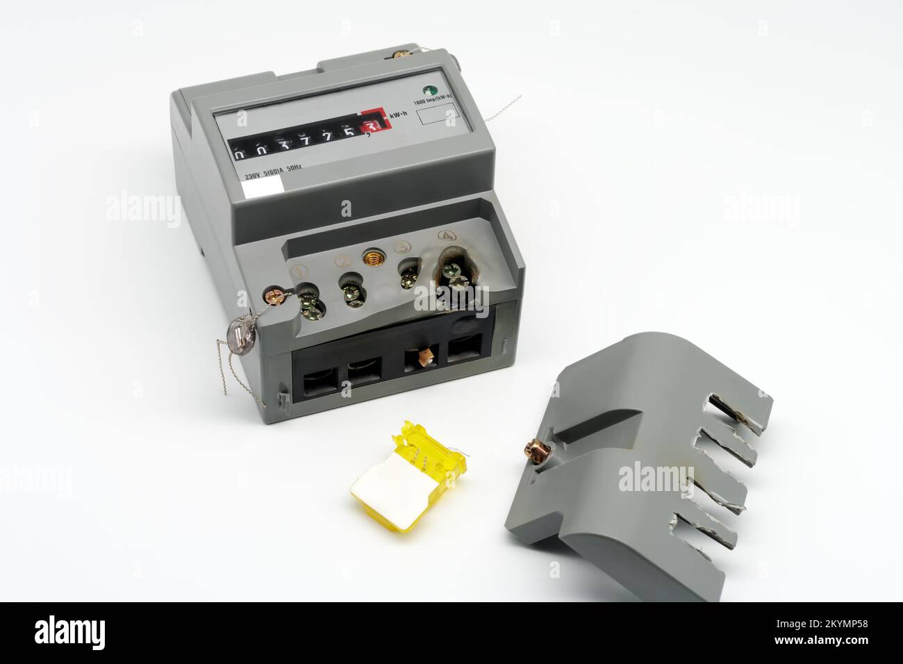 Damaged electricity meter. Melted terminal. Closeup. Isolated on white
