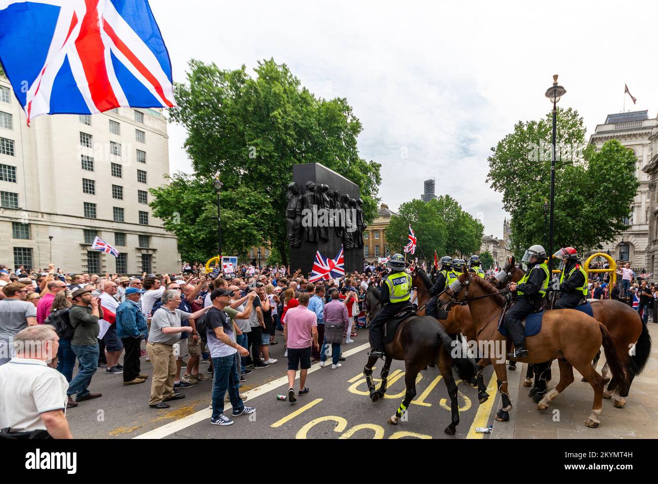 Supporters of Tommy Robinson, such as the EDL, protested in London demonstrating for his release after arrest. Mounted police in Whitehall policing Stock Photo
