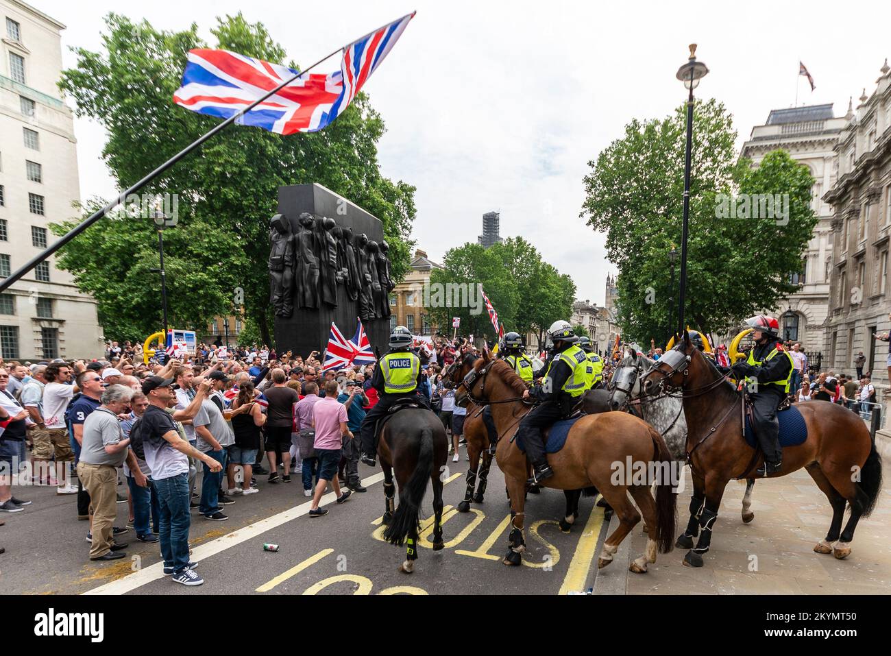 Supporters of Tommy Robinson, such as the EDL, protested in London demonstrating for his release after arrest. Mounted police in Whitehall policing Stock Photo