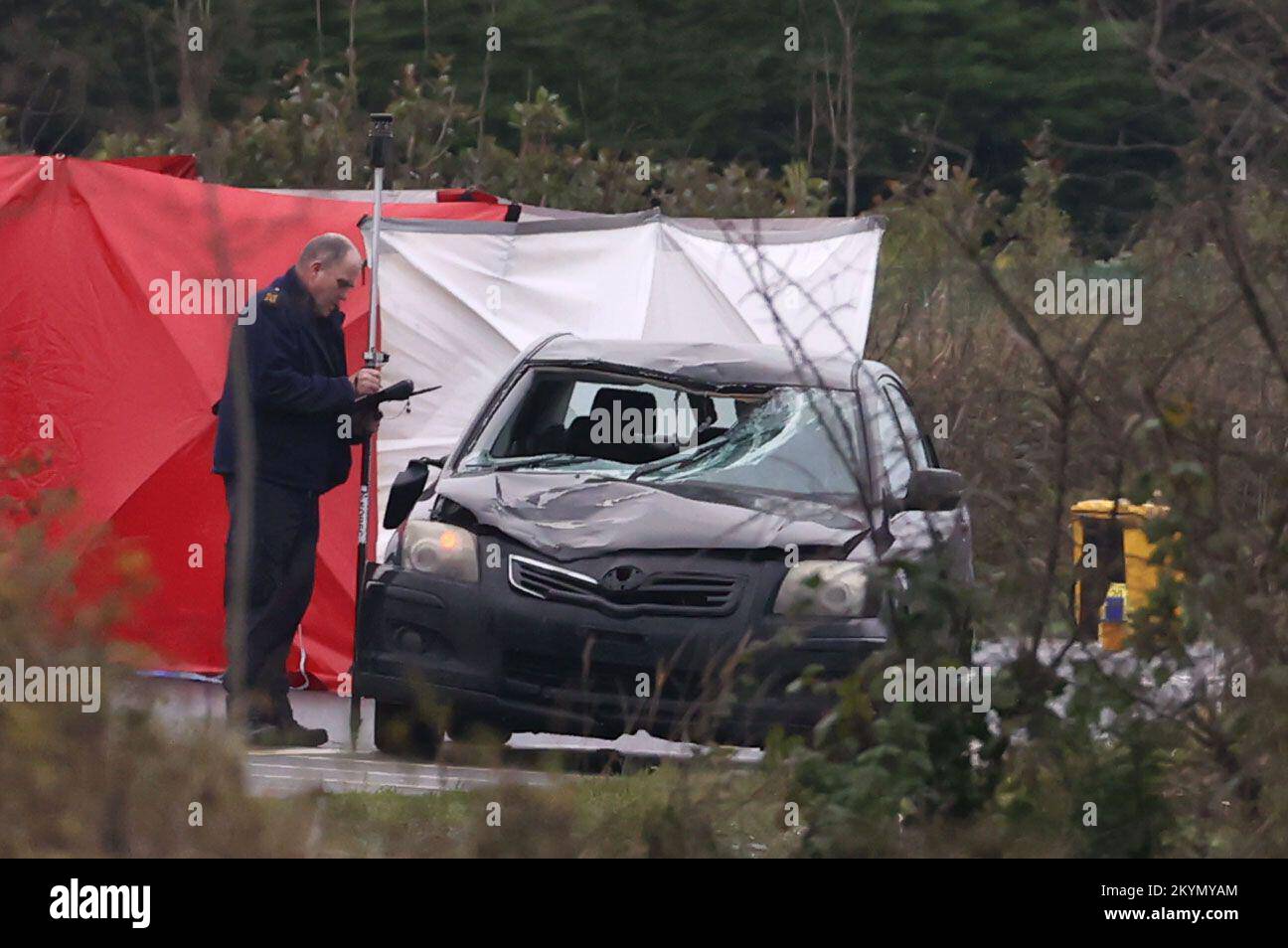 A forensic collision officer at the scene of a road crash at the Ballynacarry Bridge on the N53, Co Monaghan. The collision involved a man and a car. The pedestrian was pronounced dead and his body remains at the scene. Gardai said that no other injuries have been reported at this time. Picture date: Thursday December 1, 2022. Stock Photo