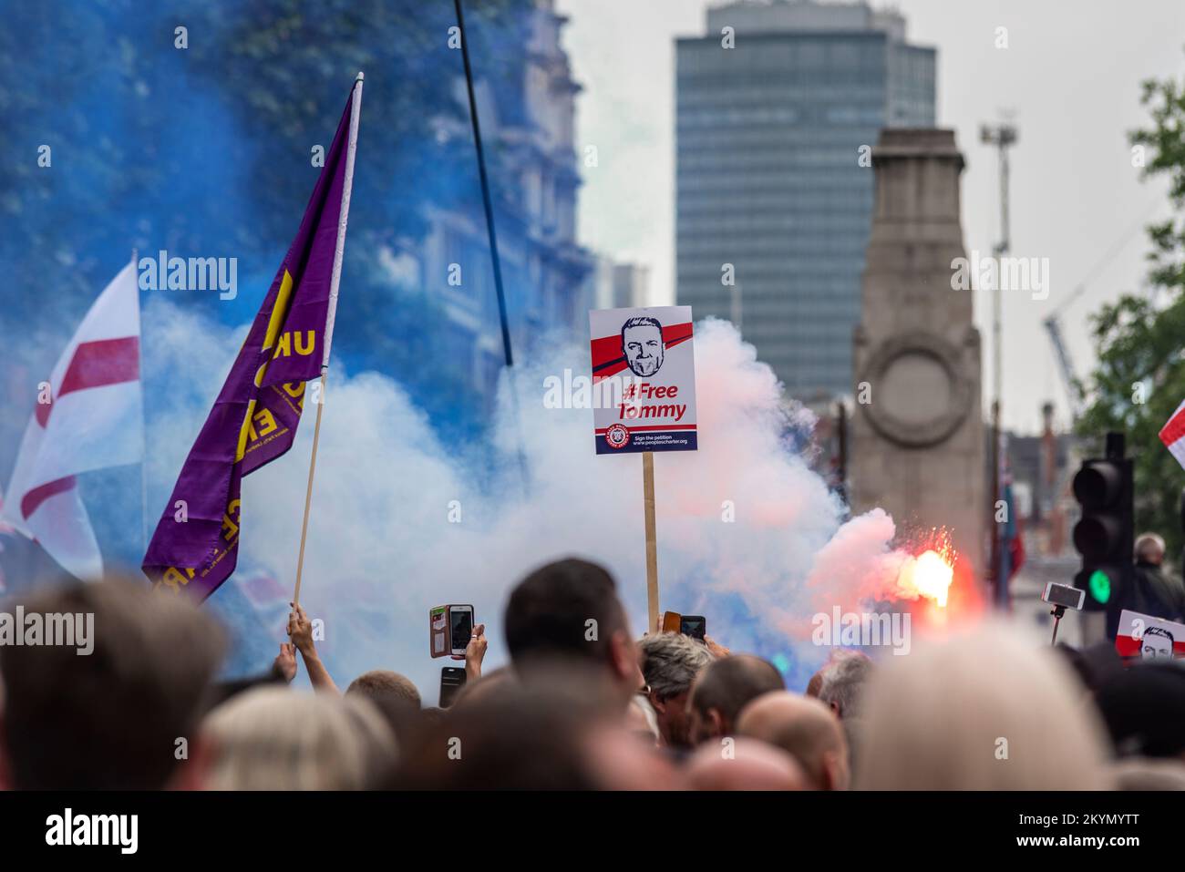Supporters of Tommy Robinson, such as the EDL, protested in London demonstrating for his release after arrest. Smoke flare and free Tommy placard Stock Photo