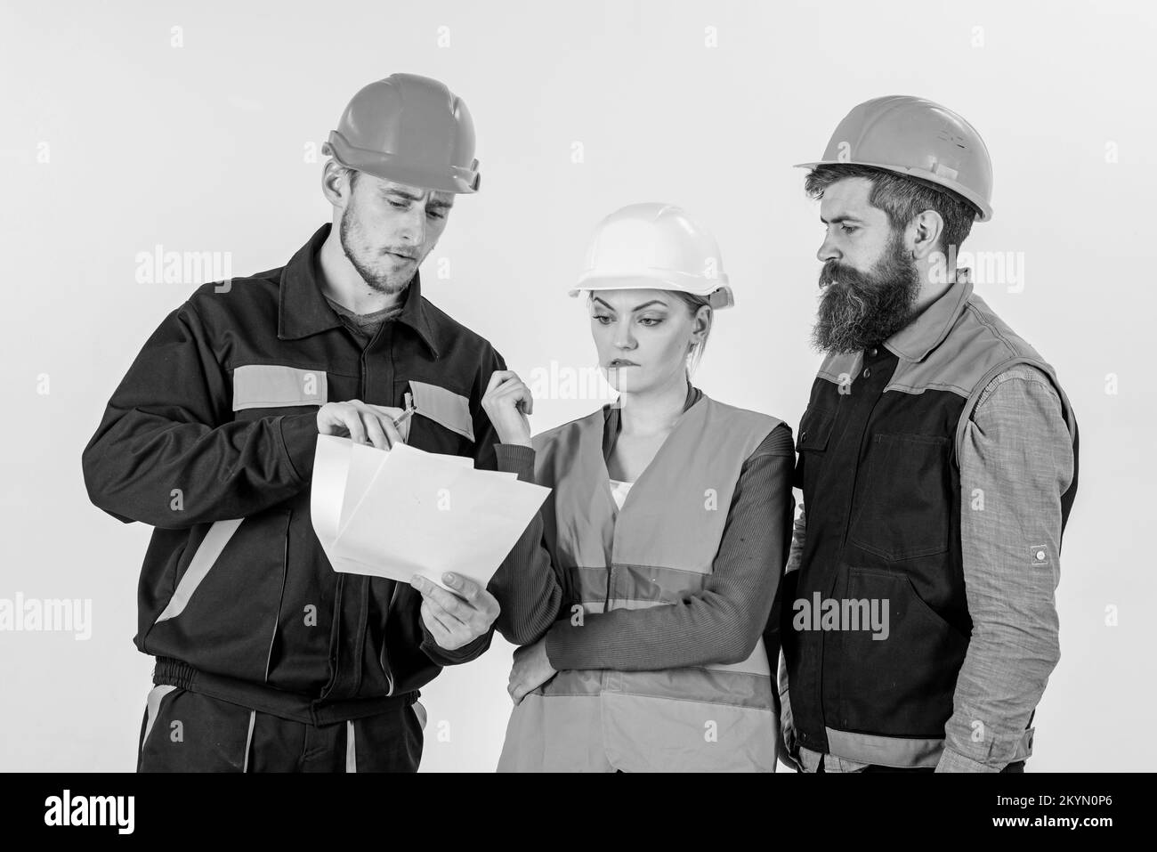 Builders and engineer arguing, misunderstanding. Team of architects