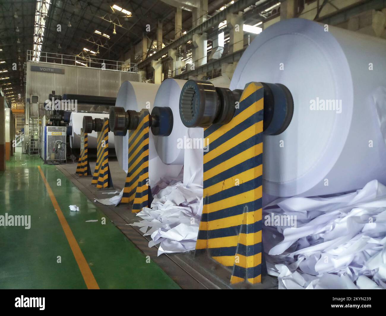 Kolkata, West Bengal, India - 16th May 2019 : White Paper Reels are being manufactured in a big paper manufacturing plant. Indian paper industry is gr Stock Photo