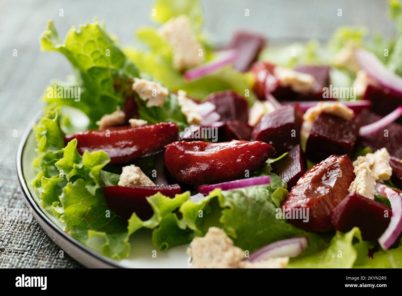 Home made beet and plum salad with vegan feta. Stock Photo