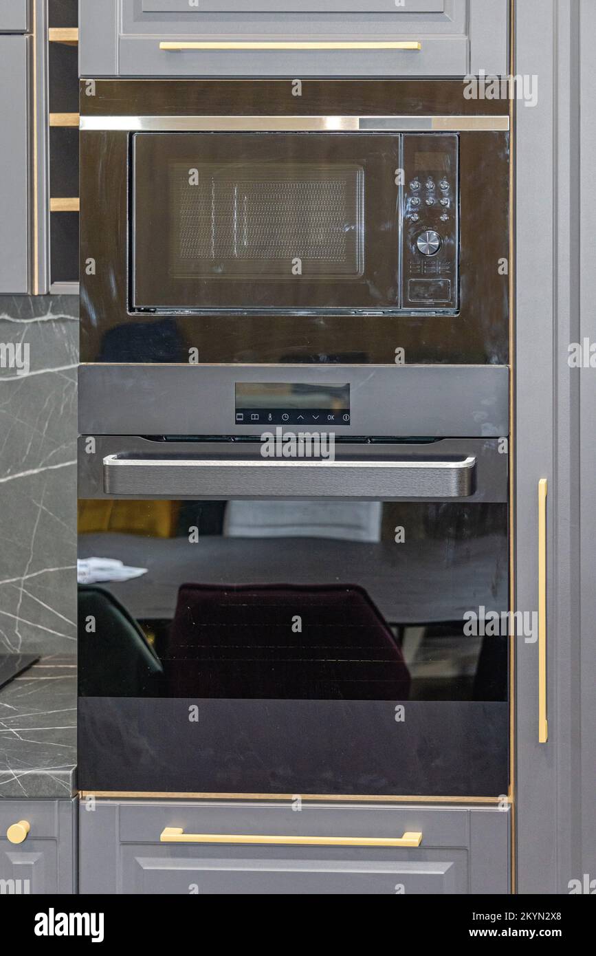 Black Microwave and Conventional Oven Built in Modern Kitchen Stock Photo Alamy