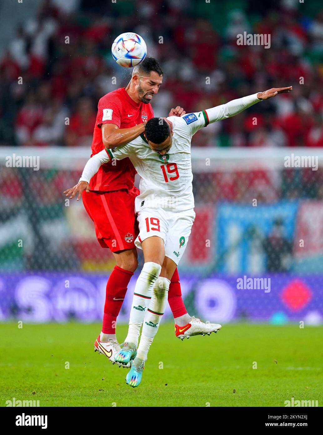 Morocco's Youssef En-Nesyri (right) and Canada's Steven Vitoria battle for the ball during the FIFA World Cup Group F match at the Al Thumama Stadium, Doha, Qatar. Picture date: Thursday December 1, 2022. Stock Photo