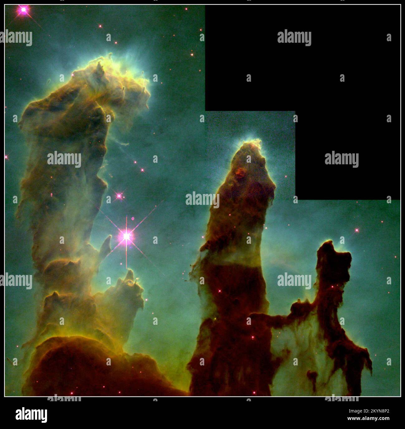 These eerie, dark pillar-like structures are columns of cool interstellar hydrogen gas and dust that are also incubators for new stars. The pillars protrude from the interior wall of a dark molecular cloud like stalagmites from the floor of a cavern. They are part of the 'Eagle Nebula' (also called M16 -- the 16th object in Charles Messier's 18th century catalog of 'fuzzy' objects that aren't comets), a nearby star-forming region 7,000 light-years away in the constellation Serpens. Ultraviolet light is responsible for illuminating the convoluted surfaces of the columns and the ghostly streamer Stock Photo