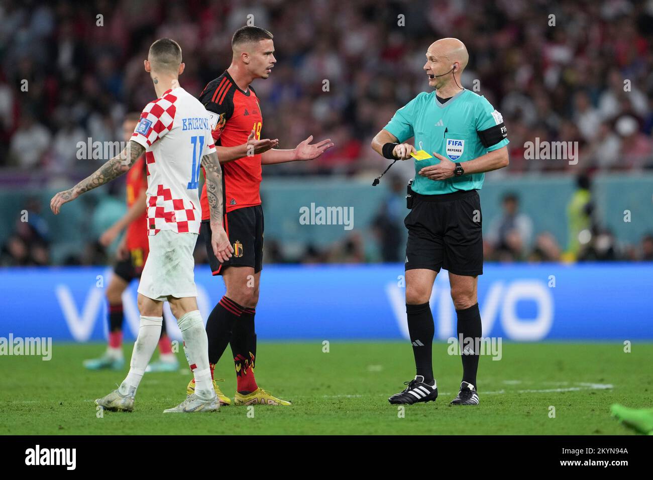 Al Rayyan, Qatar. 1st Dec, 2022. Leander Dendoncker (C) of Belgium reacts after receiving a yellow card from referee Anthony Taylor during the Group F match between Croatia and Belgium at the 2022 FIFA World Cup at Ahmad Bin Ali Stadium in Al Rayyan, Qatar, Dec. 1, 2022. Credit: Zheng Huansong/Xinhua/Alamy Live News Stock Photo