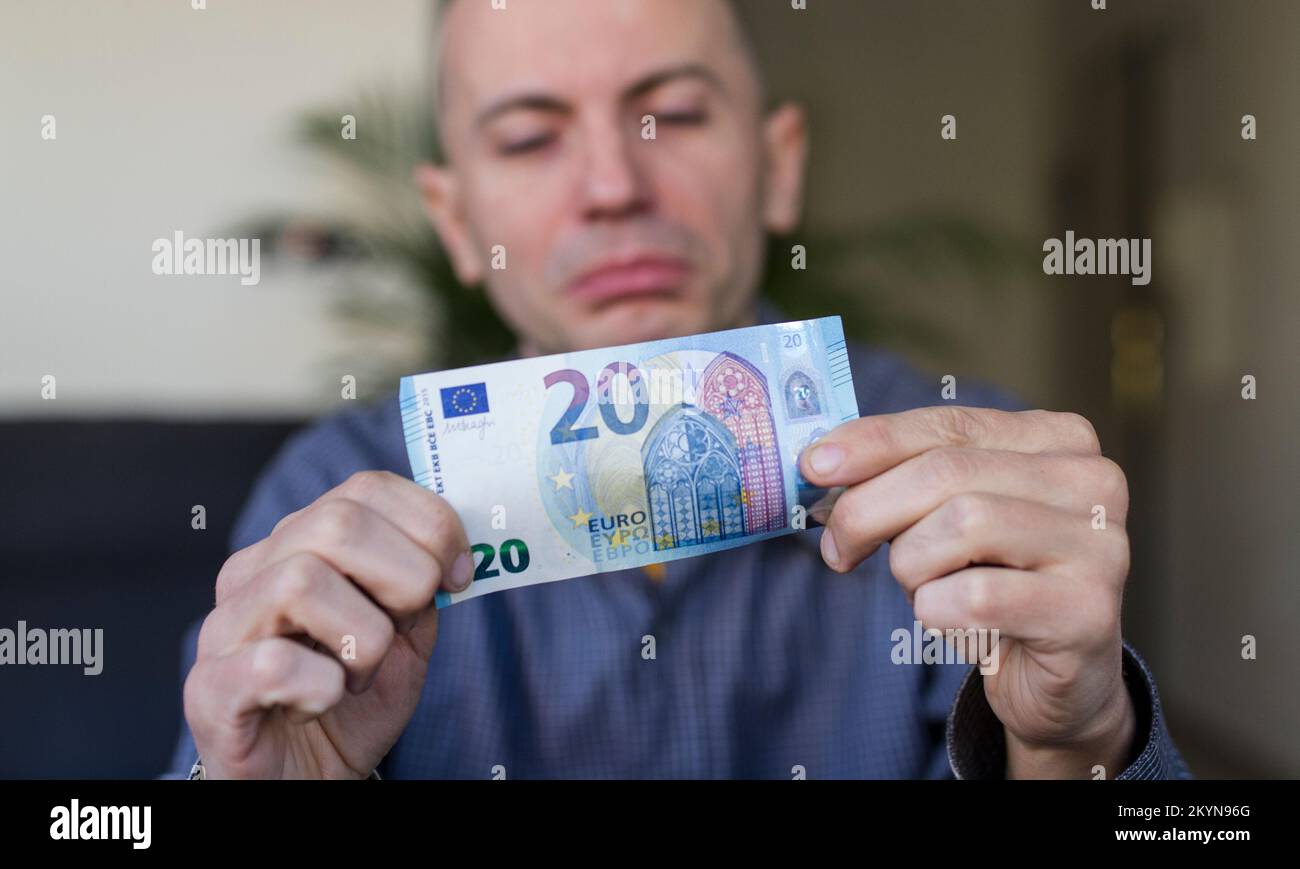white-man-watching-his-20-euro-banknote-stock-photo-alamy