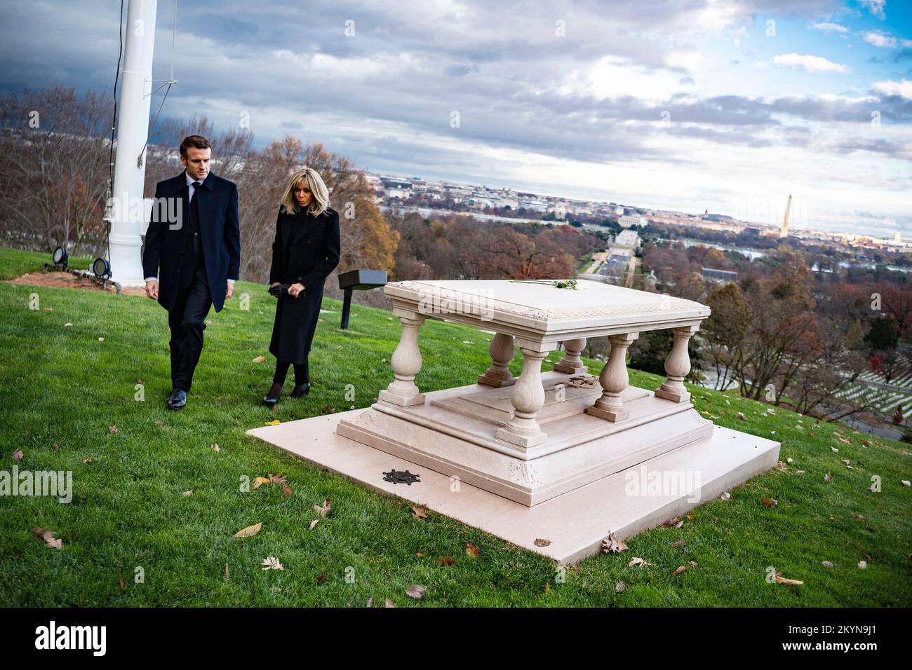 Arlington, United States Of America. 30th Nov, 2022. Arlington, United States of America. 30 November, 2022. French President Emmanuel Macron, right, and First Lady Brigitte Macron view the gravesite of Pierre Charles L'Enfant at Arlington National Cemetery, November 30, 2022 in Arlington, Virginia, USA. L'Enfant was born in Paris in 1754, but left to fight in the American Revolution and later planned the new federal city that became Washington, DC Credit: Elizabeth Fraser/U.S. Army/Alamy Live News Stock Photo
