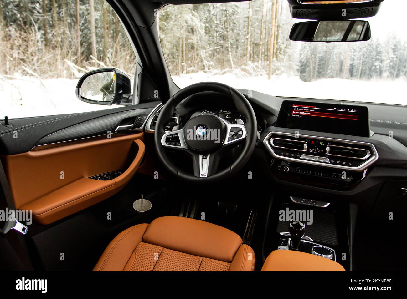 MOSCOW, RUSSIA - FEBRUARY 05, 2022. BMW X3 (G01), interior view. Compact luxury crossover SUV. BMW logo on the car steering wheel. Stock Photo