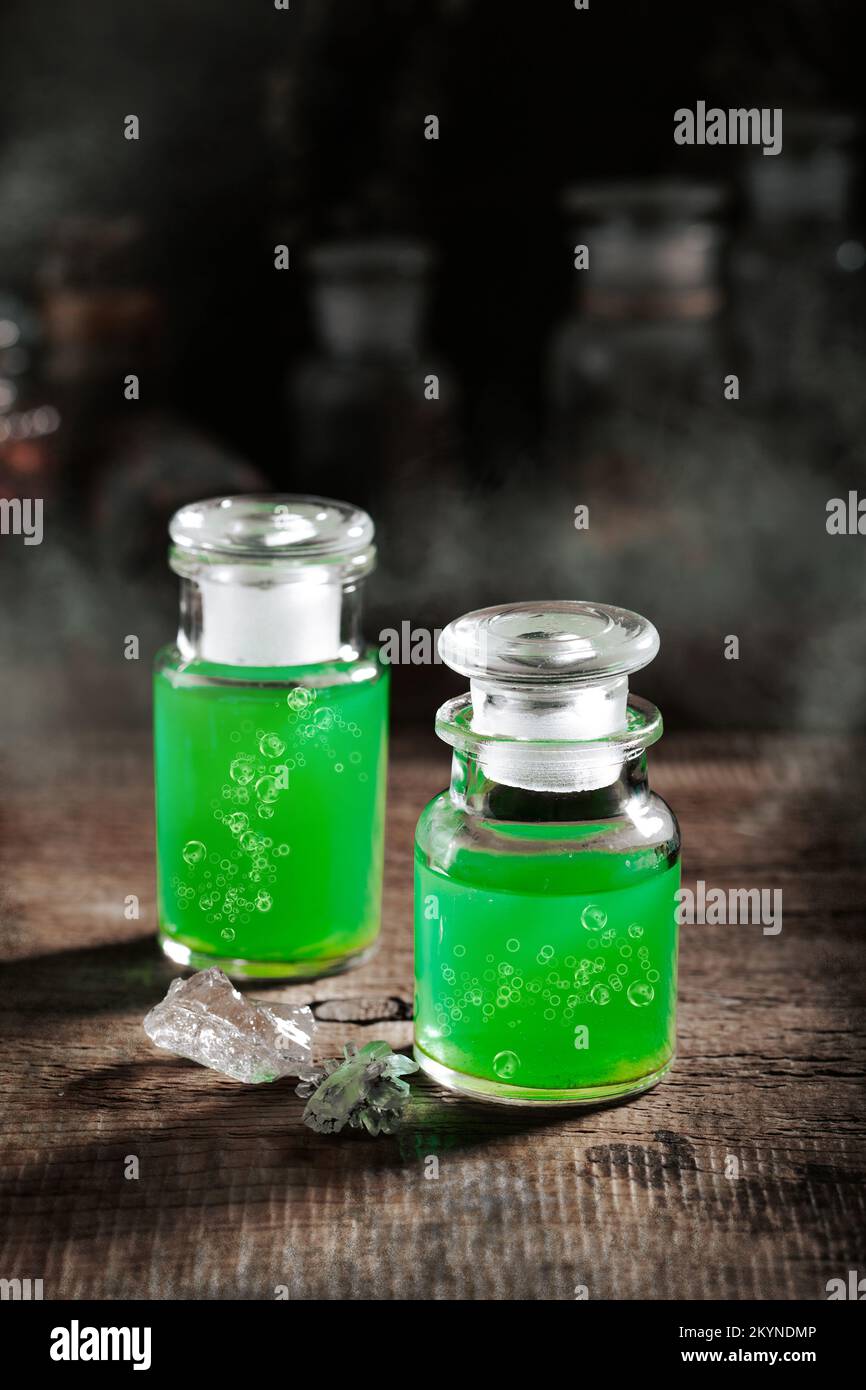 Witchcraft still life concept with potion, herbs ingredients and magical equipment Stock Photo