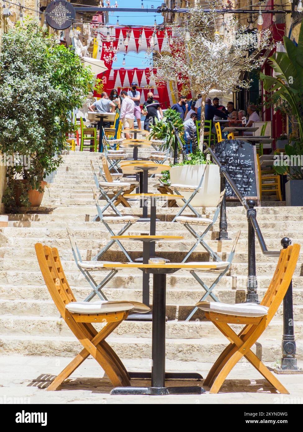 Valletta, Malta May, 2021 Wooden restaurant tables on the steps of a