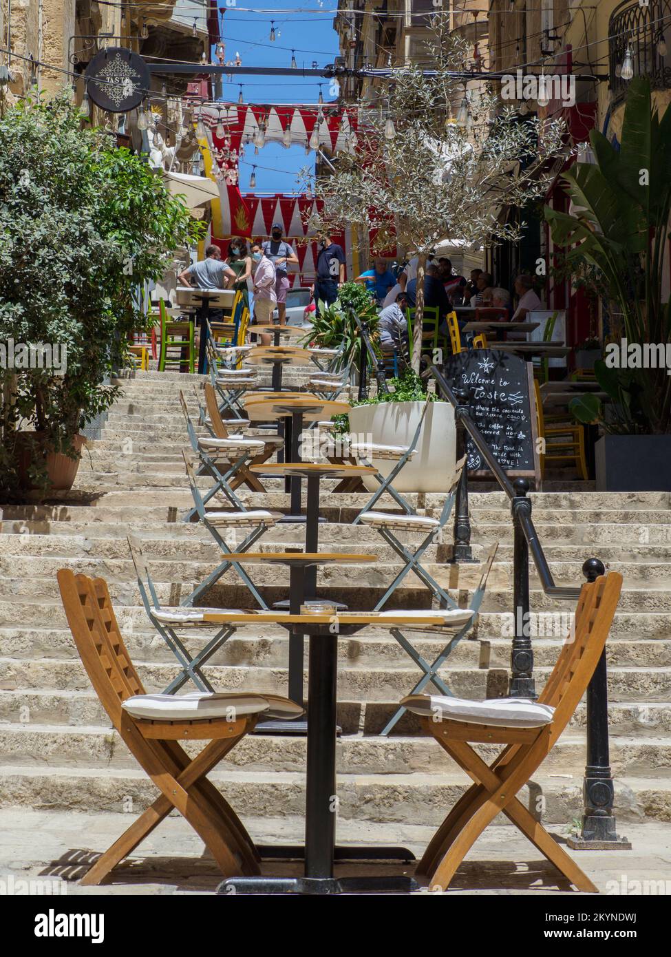 Valletta, Malta May, 2021 Wooden restaurant tables on the steps of a