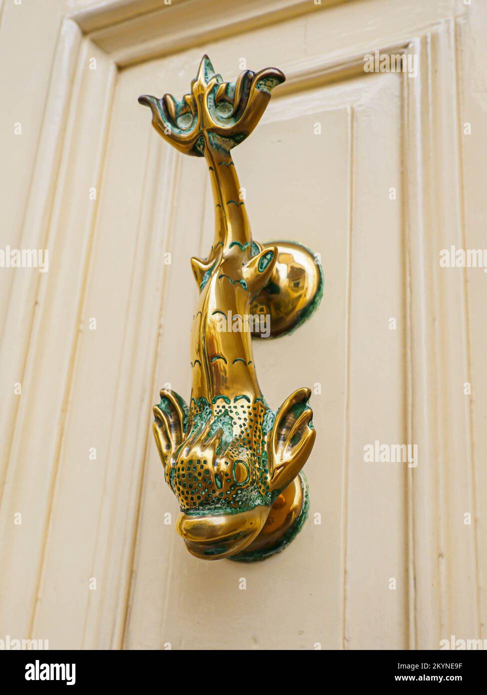 Antique door knocker on antique wooden door. Old Maltese architectural