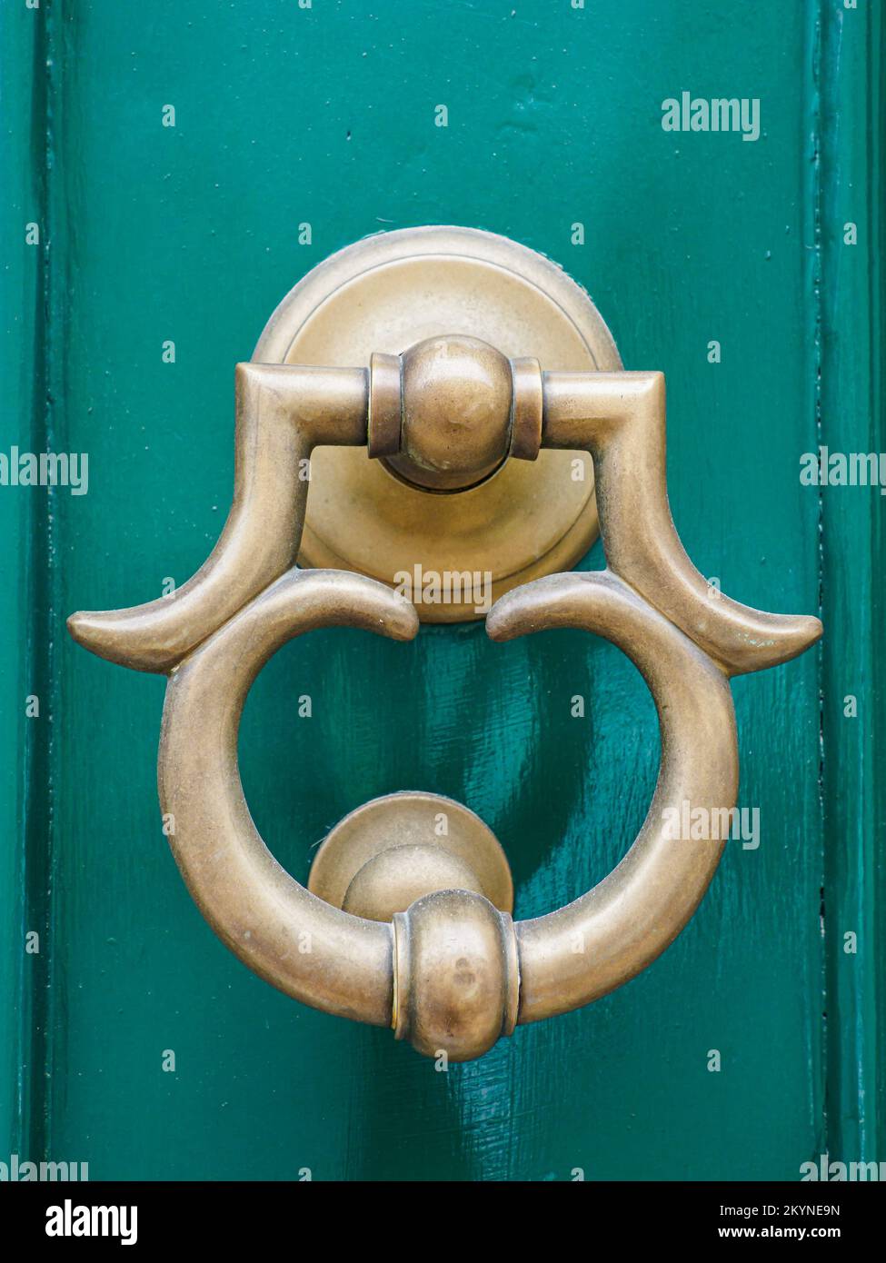 Antique door knocker on antique wooden door. Old Maltese architectural details, Malta. Europe Stock Photo