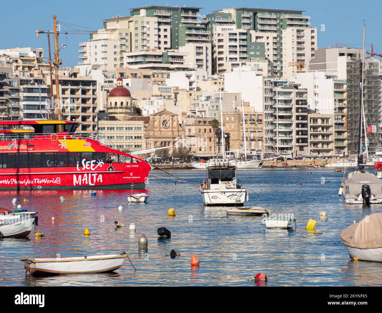 Sliema, Malta - May, 2021: Tuoristic red ship 'hop on hop off' in the port of Sliema district. Sliema Ferry port. Malta. Europe Stock Photo