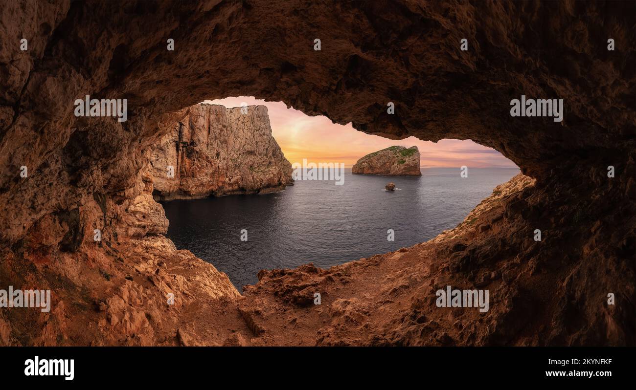 Cave on Rocky Coast with Cliffs on the Mediterranean Sea. Sardinia, Italy. Background. Stock Photo
