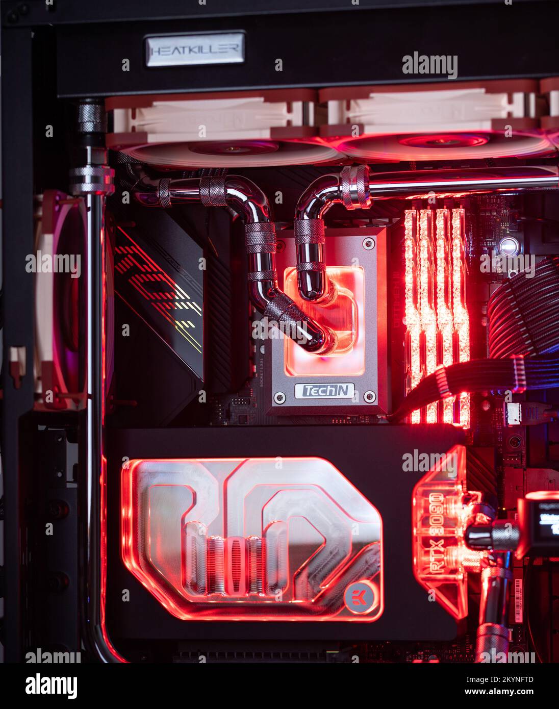 Prague, Czech Republic - 21 July 2021: Close-up of high performance Desktop PC and water cooling system with multicolored LED RGB light show status on Stock Photo