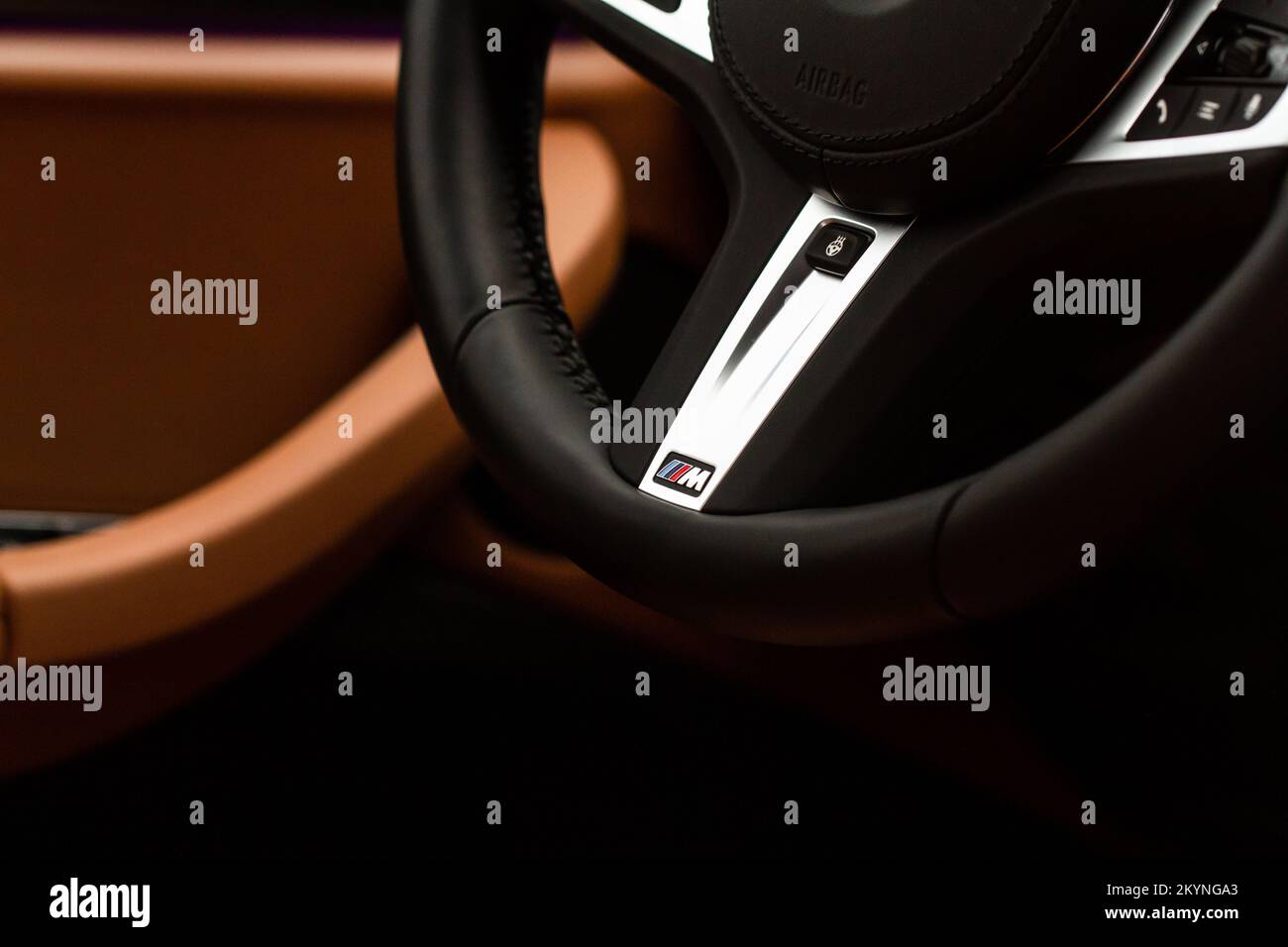 MOSCOW, RUSSIA - FEBRUARY 05, 2022 BMW M Power logo on the BMW X3 steering wheel. Steering wheel close up view. Compact luxury crossover SUV Stock Photo