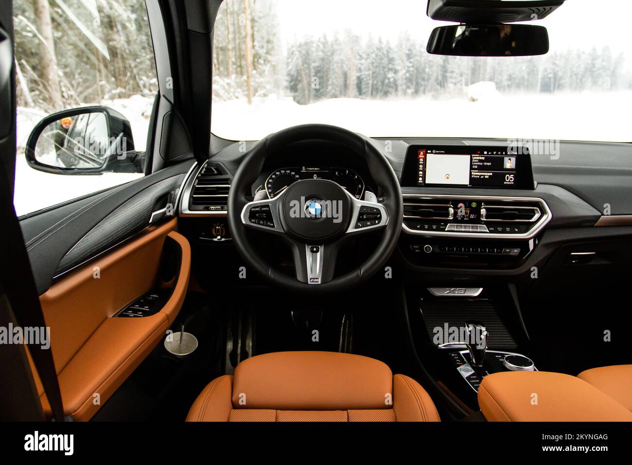 MOSCOW, RUSSIA - FEBRUARY 05, 2022. BMW X3 (G01), interior view. Compact luxury crossover SUV. BMW logo on the car steering wheel. Stock Photo