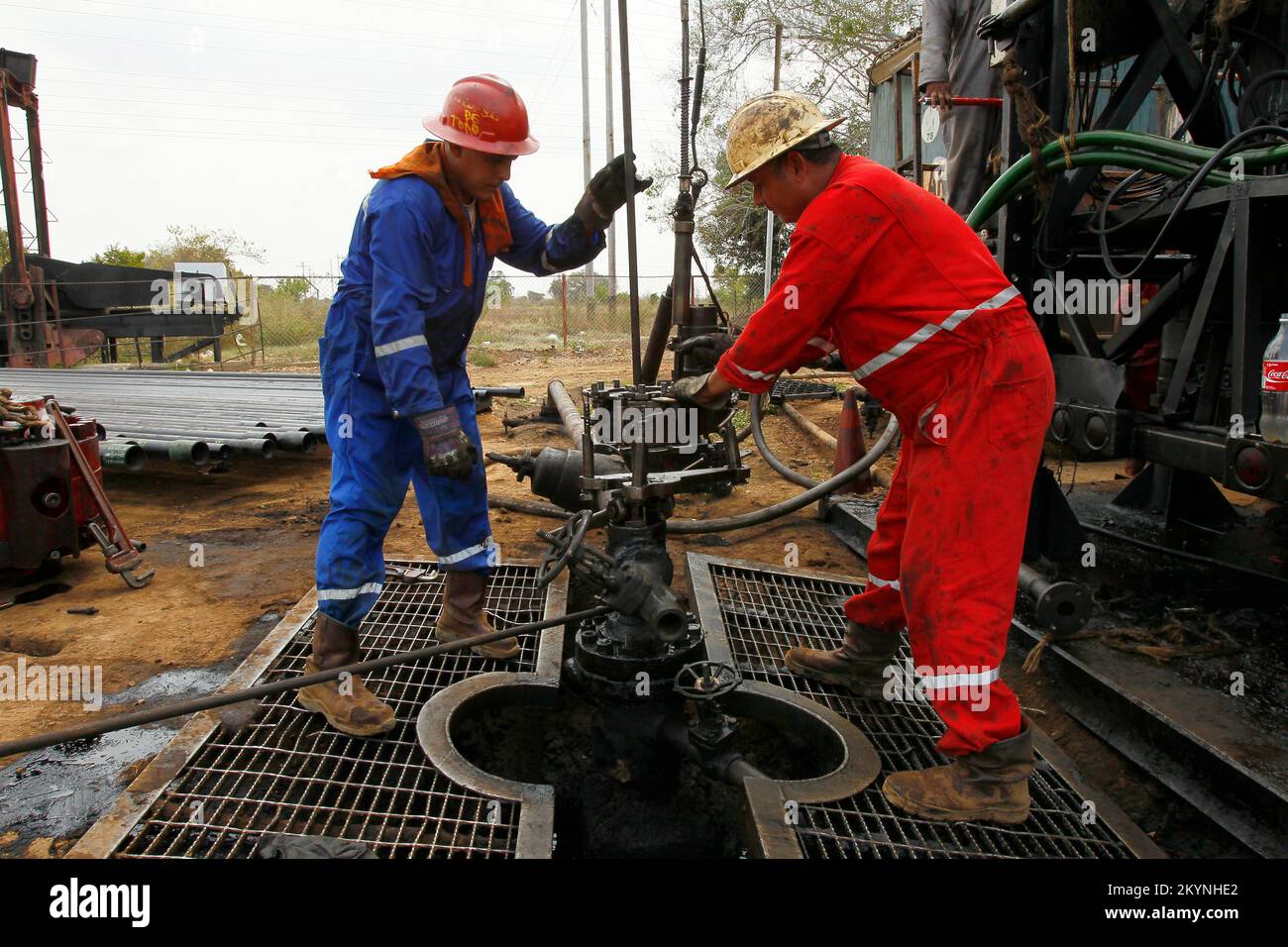 Workers of the State Oil Company of Venezuela, drill a crude well in an