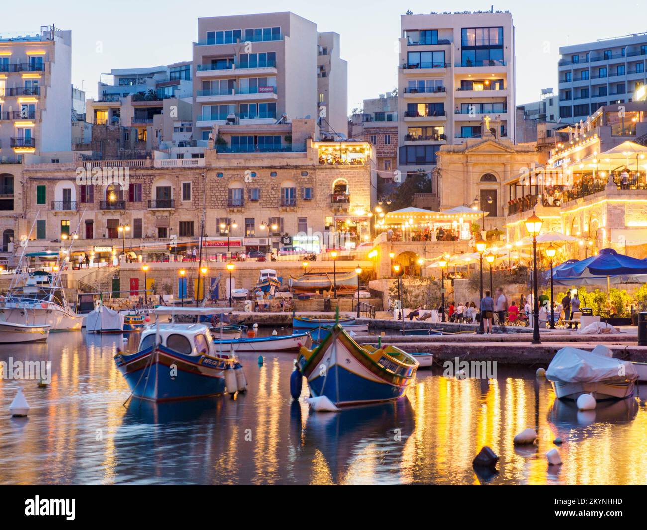 St Julian, Malta - May, 2021: Spinola bay with plenty of colorful boats ...