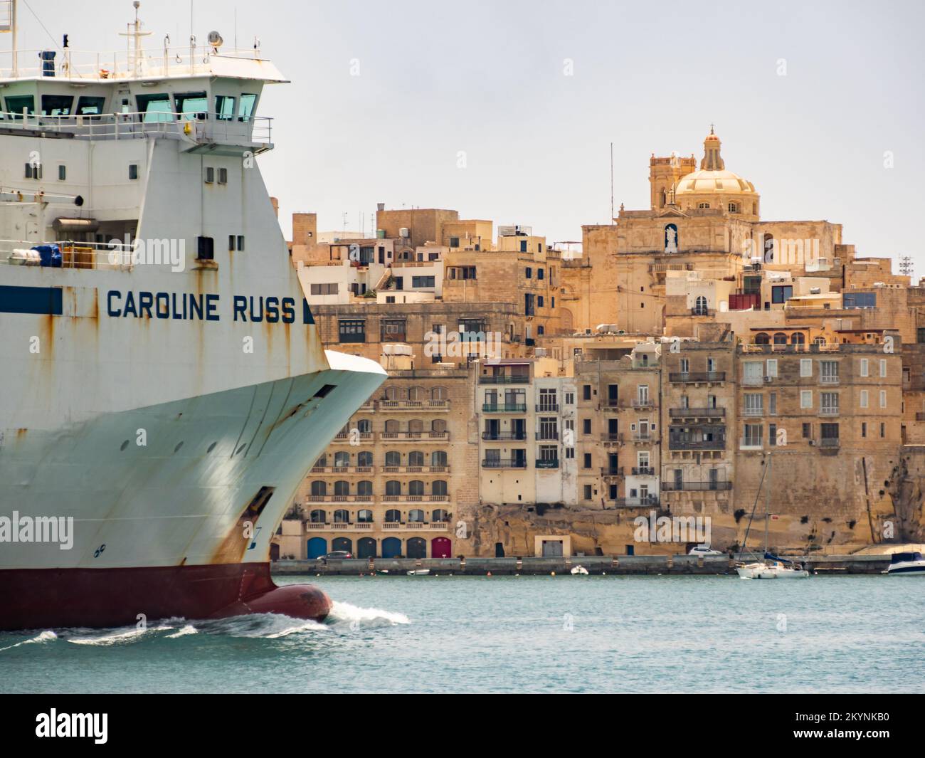Valletta, Malta May 2021. A huge cargo ship enters the port of