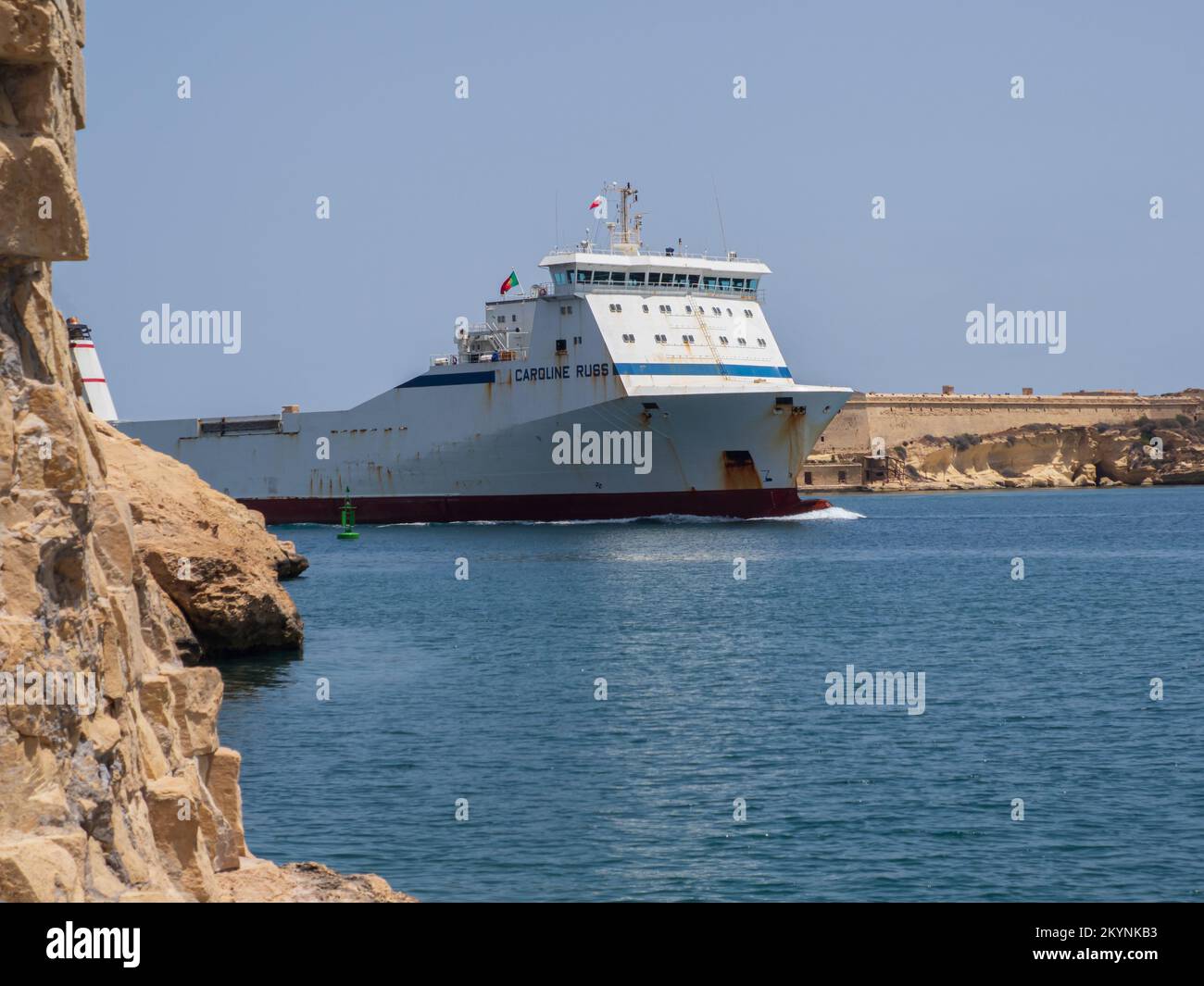 Valletta, Malta May 2021. A huge cargo ship enters the port of