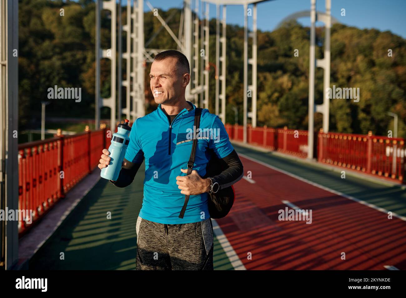 Man drinking water after running workout in morning Stock Photo Alamy