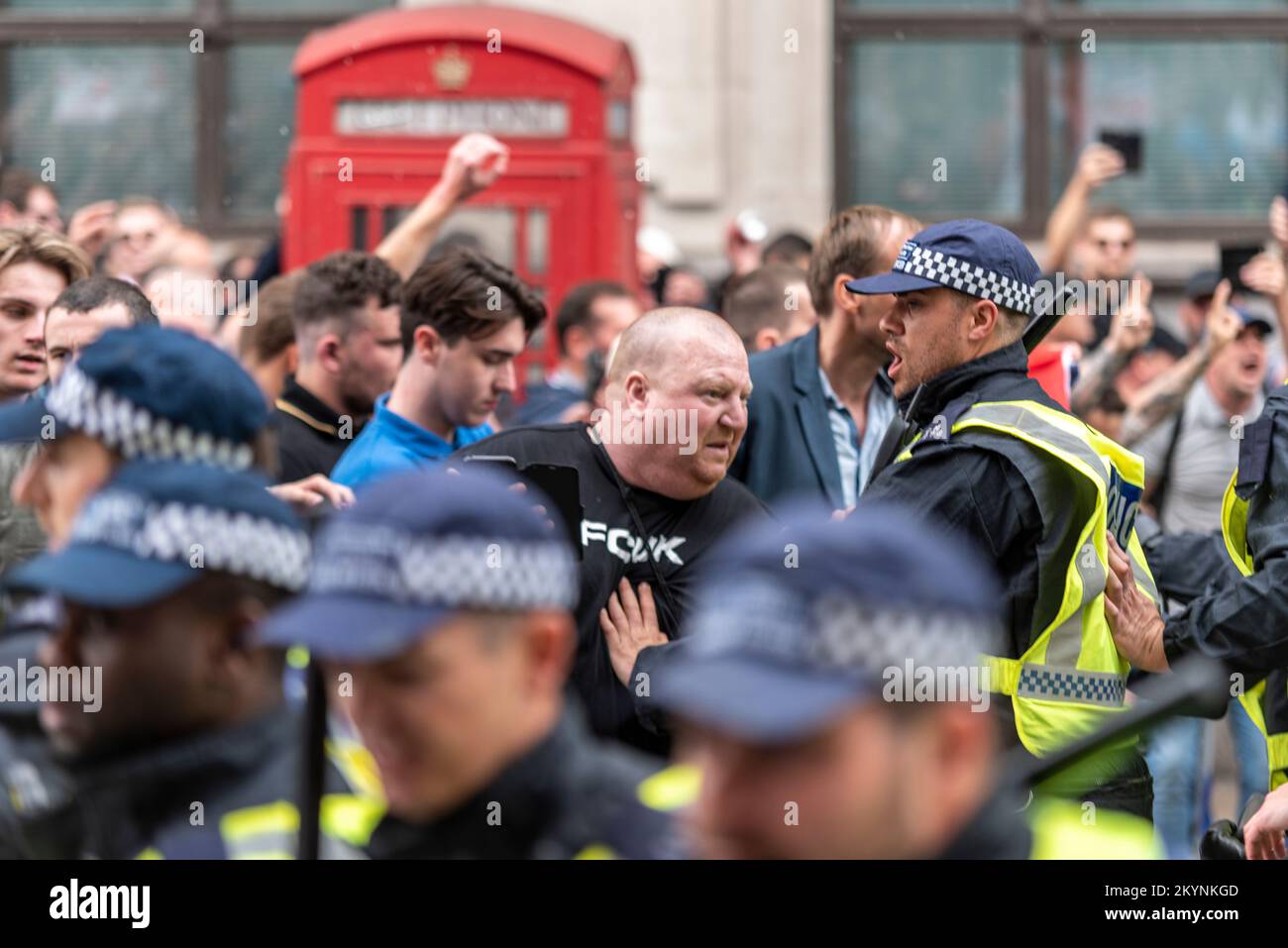 Supporters of Tommy Robinson, such as the EDL, protested in London demonstrating for his release after arrest. Police officers trying to stop them Stock Photo