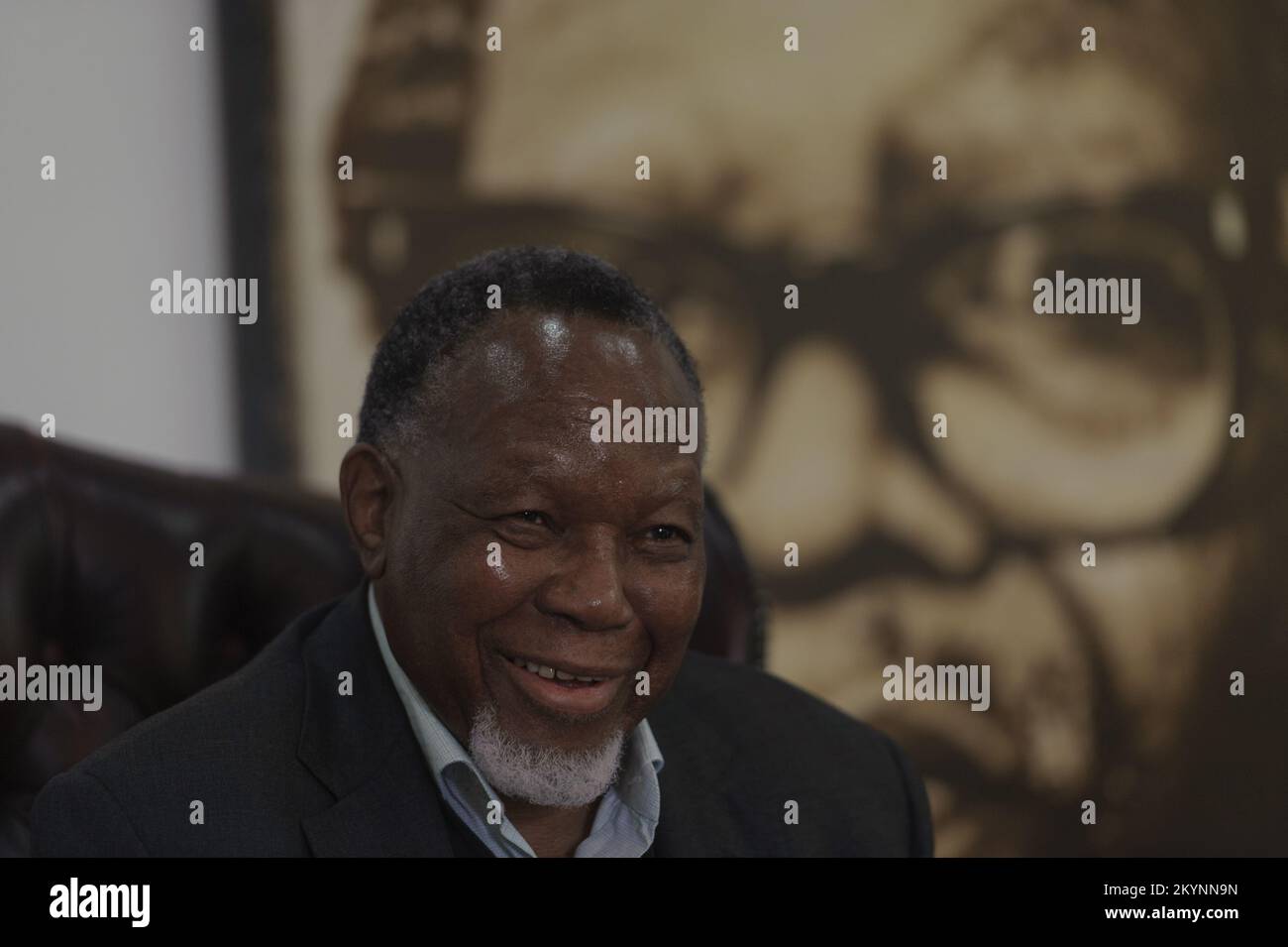 Former South Africa president Kgalema Motlanthe in the shadow of a portrait of ANC liberation icon and exiled leader during apartheid Oliver Tambo Stock Photo