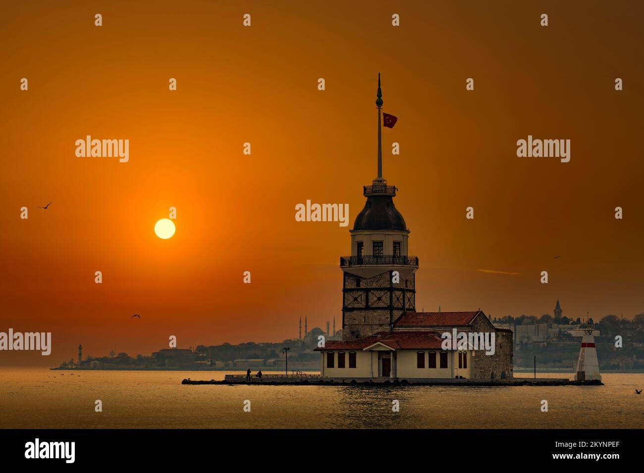 Maiden Tower (Kiz Kulesi) in Istanbul in the evening with sunset sky. Bosporus strait. Stock Photo