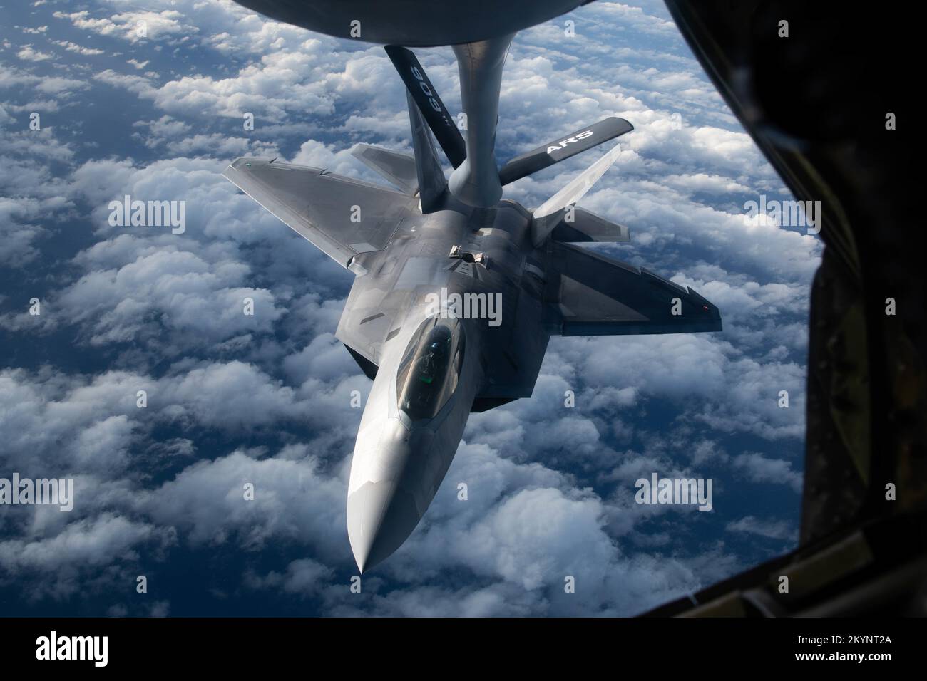 Pacific Ocean, International Waters. 30th Nov, 2022. Pacific Ocean, International Waters. 30 November, 2022. A U.S. Air Force F-22A Raptor fighter jet, assigned to the 3rd Fighter Wing, approaches a KC-135 Stratotanker refueling aircraft during a patrol mission, November 30, 2022 over the Pacific Ocean. Credit: A1C Tylir Meyer/U.S. Air Force/Alamy Live News Stock Photo