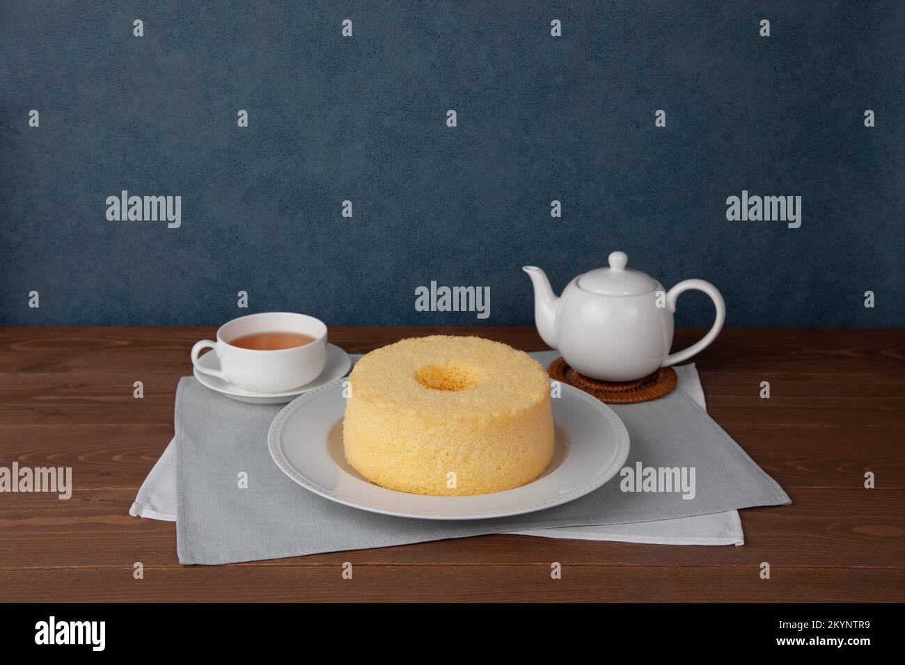 plain chiffon cake hot tea set isolated on white background Stock Photo