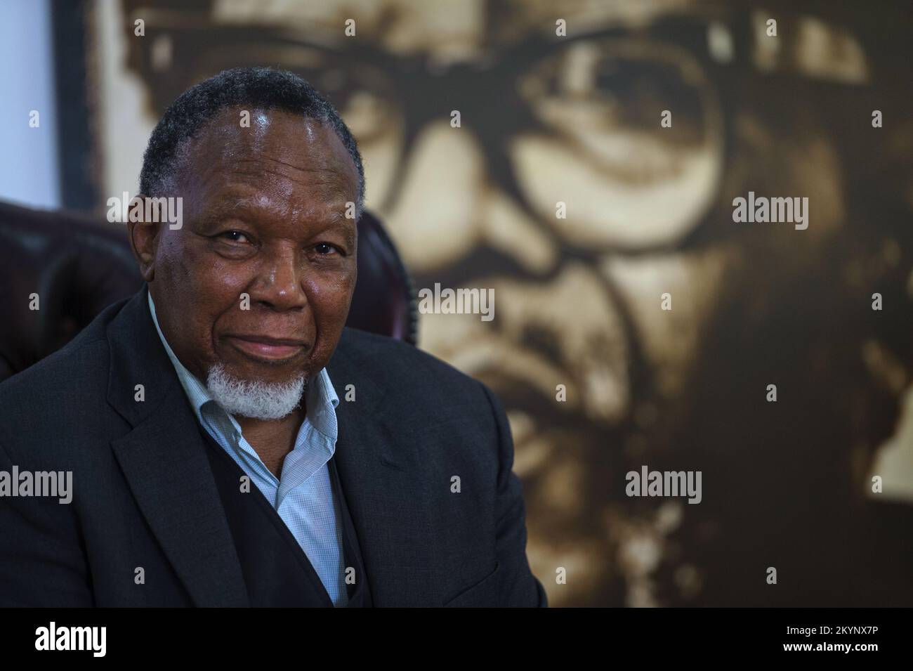 Former South Africa president Kgalema Motlanthe in the shadow of a portrait of ANC liberation icon and exiled leader during apartheid Oliver Tambo Stock Photo