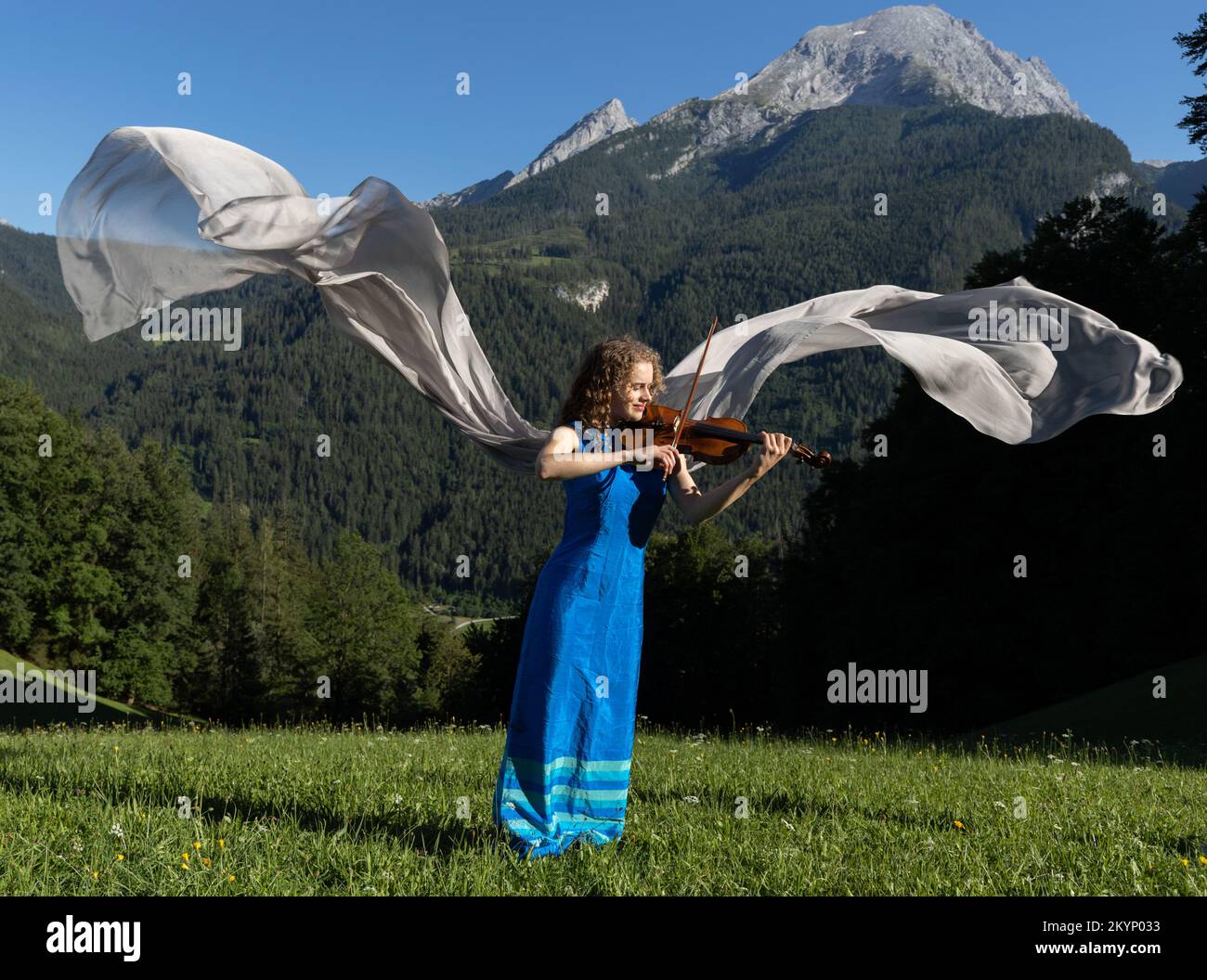 Young violinist playing the violin in the Alps Stock Photo - Alamy
