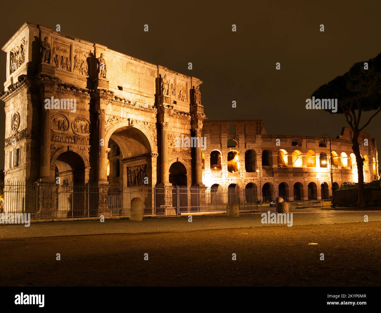 arch of constantin in front of the colosseum at night Stock Photo