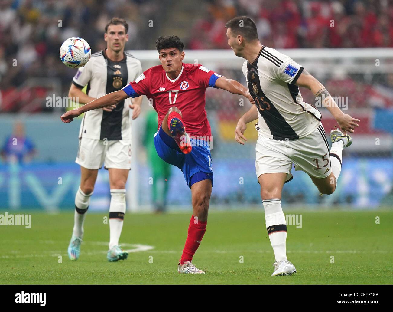 Costa Rica's Yeltsin Tejeda (centre) and Germany's Niklas Suele battle for the ball during the FIFA World Cup Group E match at the Al Bayt Stadium, Al Khor, Qatar. Picture date: Thursday December 1, 2022. Stock Photo